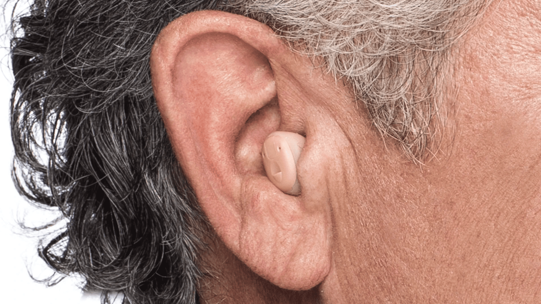 Widex ITE XP man hearing aid close up 1920x1080